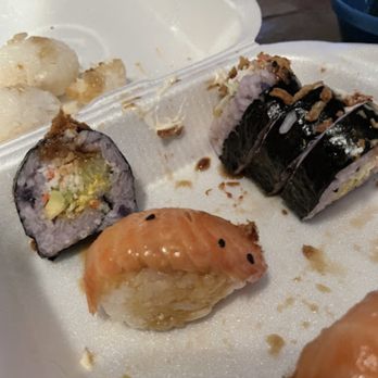 Dragon Sushi - The salmon nigiri. A sliver of fish and topped with a strange sauce - Sushi Bars Near Me - Albuquerque, New Mexico