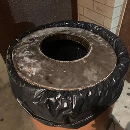 a trash can covered in plastic a trash can covered in plastic