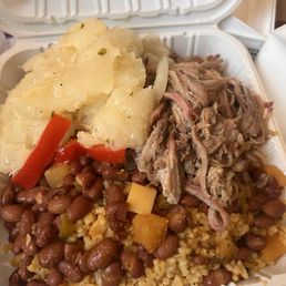 Pernil, yuca, arroz con gandules and beans