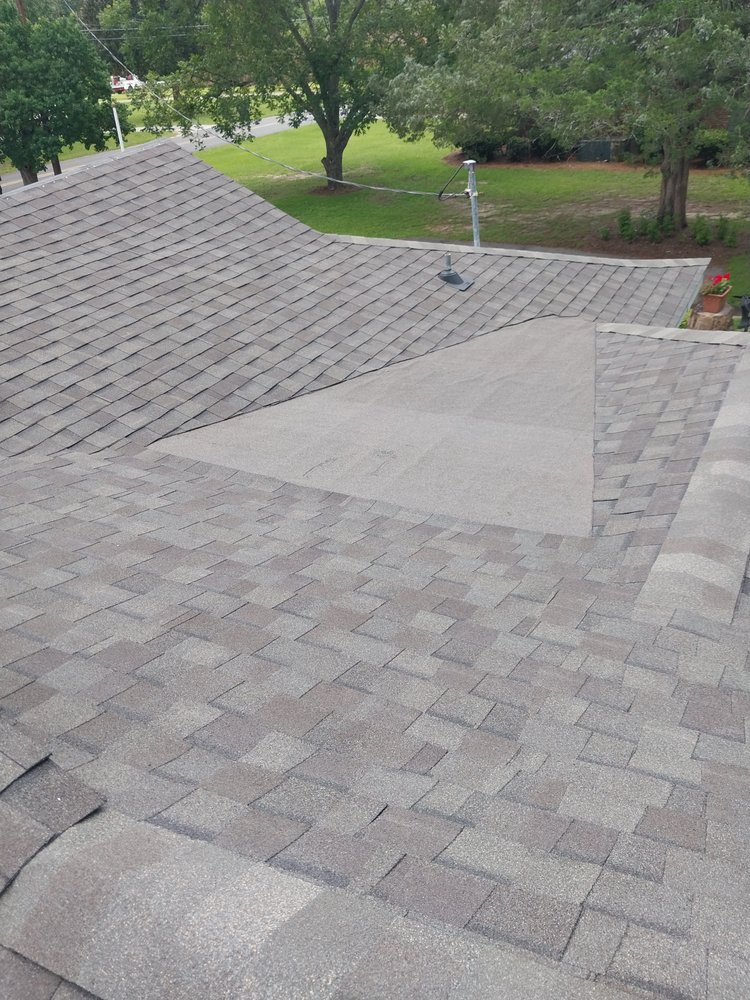 Slide of Tyndal Roofing