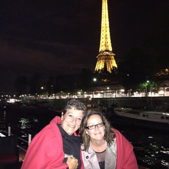 Yachts de Paris - The staff hands out warm blankets for above deck Eiffel tower light show - Boat Charters Near Me - Paris, 75