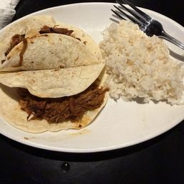 Tacos with rice. Weird to serve sticky rice with tacos though.