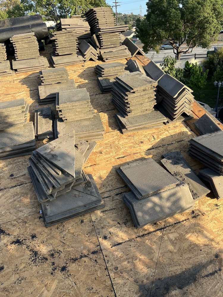 Slide of T’s Roofing 