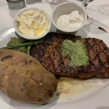 Ocean Club Restaurant - Ribeye ... perfectly cooked, chimichurri sauce was excellent. As you can see the potato needs better presentation.. - Bars Near Me - Miramar Beach, Florida Ocean Club Restaurant - Ribeye ... perfectly cooked, chimichurri sauce was excellent. As you can see the potato needs better presentation.. - Bars Near Me - Miramar Beach, Florida