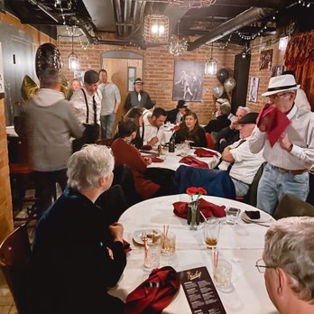 Nucky's Speakeasy - a group of people sitting around a table - Speakeasies Near Me - Anoka, Minnesota Nucky's Speakeasy - a group of people sitting around a table - Speakeasies Near Me - Anoka, Minnesota