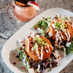 Sonny D’s Bar & Grill - NONNA IDA's LOADED POTATO CAKES
Homemade potato cakes stuffed w/ green onion, bacon, sour cream. Topped w/ the same ingredients
