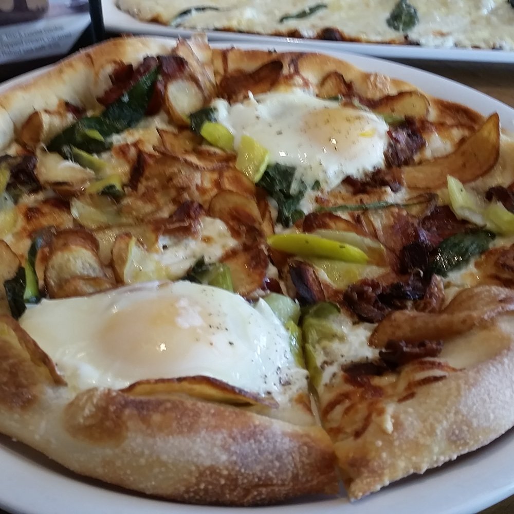 California Pizza Kitchen - Bacon, potato, leek with sunny side up eggs on a pizza. A must try. - Pizza Near Me - Naples, Florida California Pizza Kitchen - Bacon, potato, leek with sunny side up eggs on a pizza. A must try. - Pizza Near Me - Naples, Florida