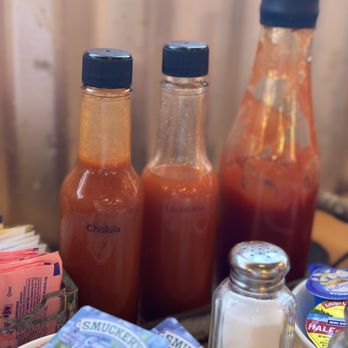 The Biscuit House - I found it very unusual, that they take condiments out of their original containers, and then put them in their own containers. - Breakfast & Brunch Near Me - Gilbert, Arizona