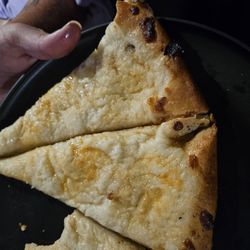 Pudgie's Pizza & Subs - Large pizza slices no sauce