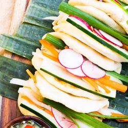 Bun Intended Food Truck - Thai basil chicken served on an open bun with daikon, carrots, cilantro, Hoisin sauce!