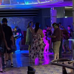 Royal Caribbean - Serenade of the Seas - Silent disco. You dance to whatever you hear in your headphones.