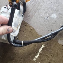 Antero Foreign Automotive - Hard line has kink and the hose was out of position causing the fuel pump Bob installed to fail.
