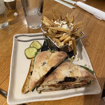 Post 25 Kitchen & Lounge - Chicken Caprese Sandwich with Greek Fries - Bars Near Me - Arden, North Carolina Post 25 Kitchen & Lounge - Chicken Caprese Sandwich with Greek Fries - Bars Near Me - Arden, North Carolina
