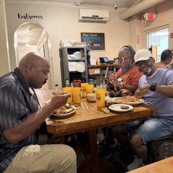 Brother Juniper's - Family enjoying meal. Pancake covers the ENTIRE plate! - Breakfast & Brunch Near Me - Memphis, Tennessee