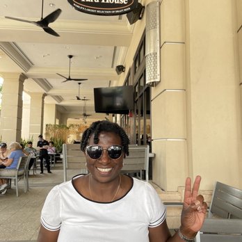Yard House - My beautiful mother enjoying the outdoor seating. - Bars Near Me - Hallandale Beach, Florida