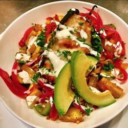 Chicken & Cheese Stuffed Relleno Bowl with Roasted Fideo Pasta and Sautéed Vegetables topped with Crema and Fresh Cilantro.