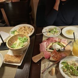 Calamari, Caesar salad, gnocchi and meat and cheese tray. Calamari, Caesar salad, gnocchi and meat and cheese tray.