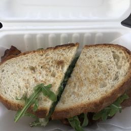 Dawn Patrol sandwich- egg, bacon,arugula and lemon poppy aioli on sourdough-great breakfast sandwich. Dawn Patrol sandwich- egg, bacon,arugula and lemon poppy aioli on sourdough-great breakfast sandwich.