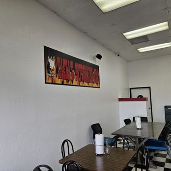 Taeza's Bottom Line Bbq - Logo in dining area - Barbeque Near Me - Sacramento, California Taeza's Bottom Line Bbq - Logo in dining area - Barbeque Near Me - Sacramento, California