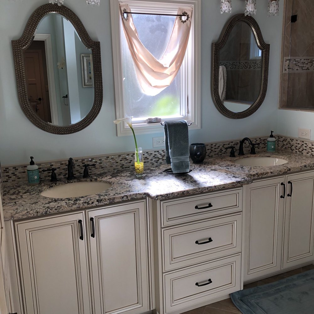 Kaitz Construction - Remodeled master bathroom. Much more space efficient due to Rick's brilliant ideas with both the vanity and linen closet details - General Contractors Near Me