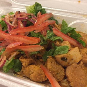 Klay Oven Kitchen - Chicken tikka masala over rice with lettuce, tomato, and onions - Indian Near Me - Chicago, Illinois Klay Oven Kitchen - Chicken tikka masala over rice with lettuce, tomato, and onions - Indian Near Me - Chicago, Illinois