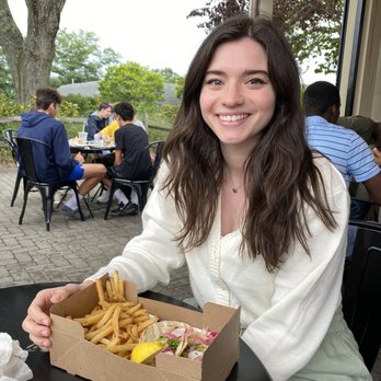 the knack - Me with veggie tacos and french fries in the seating area - Seafood Near Me - Orleans, Massachusetts