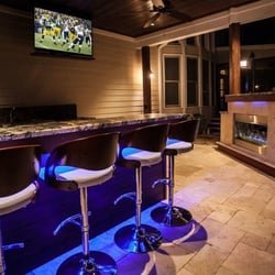 Premier Stone - Travertine Stone Paver Patio is featured in this outdoor living area.