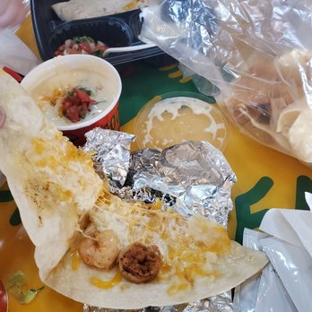 Fuzzy's Taco Shop - My two little shrimp on a 1/4 of my almost $9 shrimp quesadilla. Cheese is not even fully melted. - Breakfast & Brunch Near Me - Carrollton, Texas Fuzzy's Taco Shop - My two little shrimp on a 1/4 of my almost $9 shrimp quesadilla. Cheese is not even fully melted. - Breakfast & Brunch Near Me - Carrollton, Texas