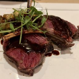 Rack of Elk - 11 oz two bone rack of elk, herb roasted potatoes, roasted baby zucchini with bacon, burgundy reduction Rack of Elk - 11 oz two bone rack of elk, herb roasted potatoes, roasted baby zucchini with bacon, burgundy reduction