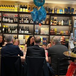 Sarti - Group table out near the bar