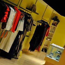 Davis Interiors - Boutique Store Spray Paint Black/Yellow by Davis Interiors. Davis Interiors also buffed the floor back to life.