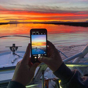 Wombat Charters - Captain Bob took a great picture of me taking a picture of the sunset. - Fishing Near Me