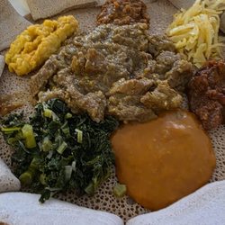 Vegan platter and curry with beef.