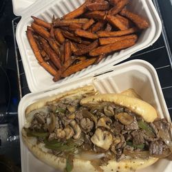 The Original Philadelphia Cheese Steaks - Philly cheesesteak with onions, bell peppers, cheese, mushrooms and and sweet potato fries