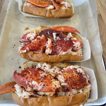 Luke's Lobster - Top: Warm butter lobster roll Bottom Two: Warm Spicy Honey lobster roll - Seafood Near Me - Seattle, Washington Luke's Lobster - Top: Warm butter lobster roll Bottom Two: Warm Spicy Honey lobster roll - Seafood Near Me - Seattle, Washington