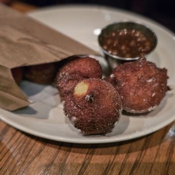 Les Cavistes - three donuts on a plate - French Near Me - Montreal, Quebec Les Cavistes - three donuts on a plate - French Near Me - Montreal, Quebec