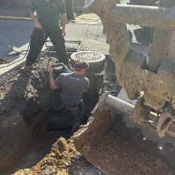 Bosetti Lawn Care - Digging up the ground to install new sewage pipes.