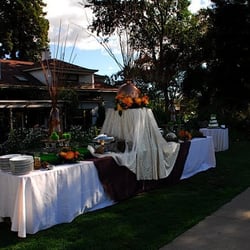 Little House Weddings - Buffet by the pool with the house in the back