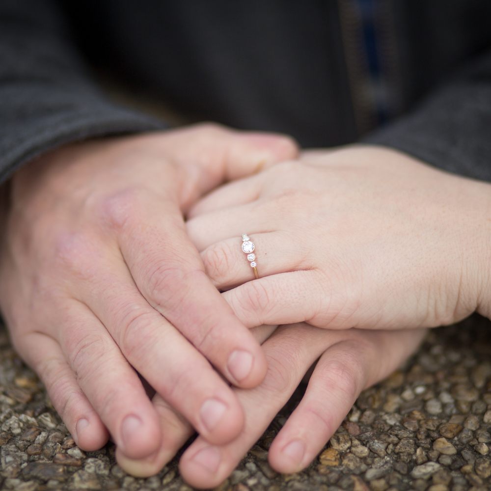 A photo of my hands and my fiancee's with the ring on it. A beautiful ring, gorgeous ethical diamonds, and wonderfully made to boot. A photo of my hands and my fiancee's with the ring on it. A beautiful ring, gorgeous ethical diamonds, and wonderfully made to boot.