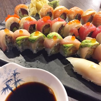 Sushi UNI - From nearest to furthest: Super white tuna sushi, the dragon ball roll, candy cane roll, and sunshine roll. - Sushi Bars Near Me - Lenexa, Kansas Sushi UNI - From nearest to furthest: Super white tuna sushi, the dragon ball roll, candy cane roll, and sunshine roll. - Sushi Bars Near Me - Lenexa, Kansas