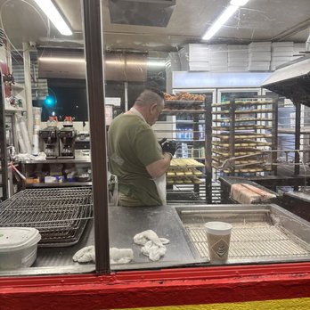 Doughnut Hut - Wearing sticky gloves and using a phone but touching donuts with the same gloves... - Donuts Near Me - Burbank, California