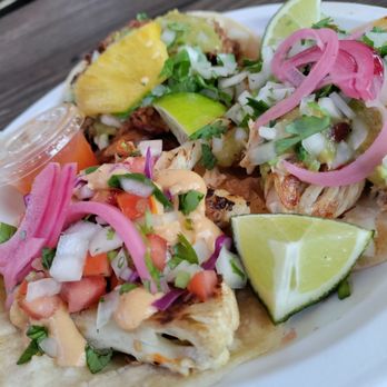 Dos Jefes - Cauliflower taco (left), pork street taco (back), and roasted chicken street taco (right) - Tacos Near Me Dos Jefes - Cauliflower taco (left), pork street taco (back), and roasted chicken street taco (right) - Tacos Near Me