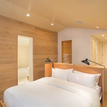 Lester Development - a bedroom with wood paneling - General Contractors Near Me