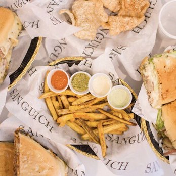 Sanguich - You cannot go wrong no matter what you order...featured in the center, their plantain fries!! - Cuban Near Me - Miami, Florida