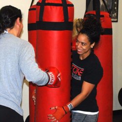 2 Tone Boxing Club - Tara holding the bag for some guests