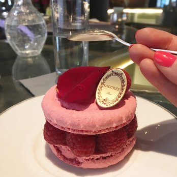 Ladurée - The rose macaron filled with rose petal and lychee cream, and embellished with fresh raspberries at Ladurée Paris Champs-Élysées. - Macarons Near Me - Paris, 75