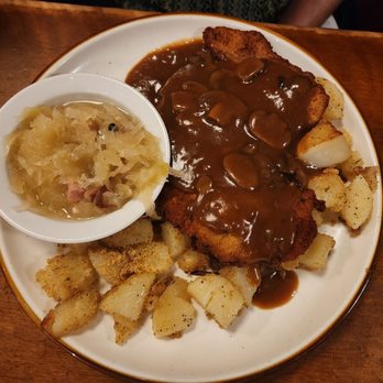 Student Prince - Pork Schnitzel with Mushroom Gravy, fried potatoes, Sauerkraut. Same sauce used on my Sauerbraten, not the way it's done - German Near Me - Springfield, Massachusetts