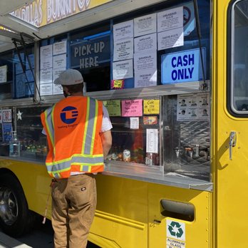 Yuyis Tacos - a man ordering food from a food truck - Food Trucks Near Me Yuyis Tacos - a man ordering food from a food truck - Food Trucks Near Me