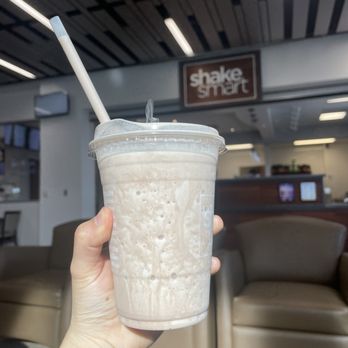 Shake Smart - a hand holding a cup of milkshake - Juice Bars & Smoothies Near Me - Long Beach, California Shake Smart - a hand holding a cup of milkshake - Juice Bars & Smoothies Near Me - Long Beach, California
