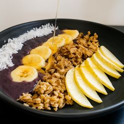 Mountain Lotus Provisions - Açaí Bowl - Açaí, homemade granola, banana, seasonal fruit, coconut flakes, cashew butter drizzle, edible flowers.